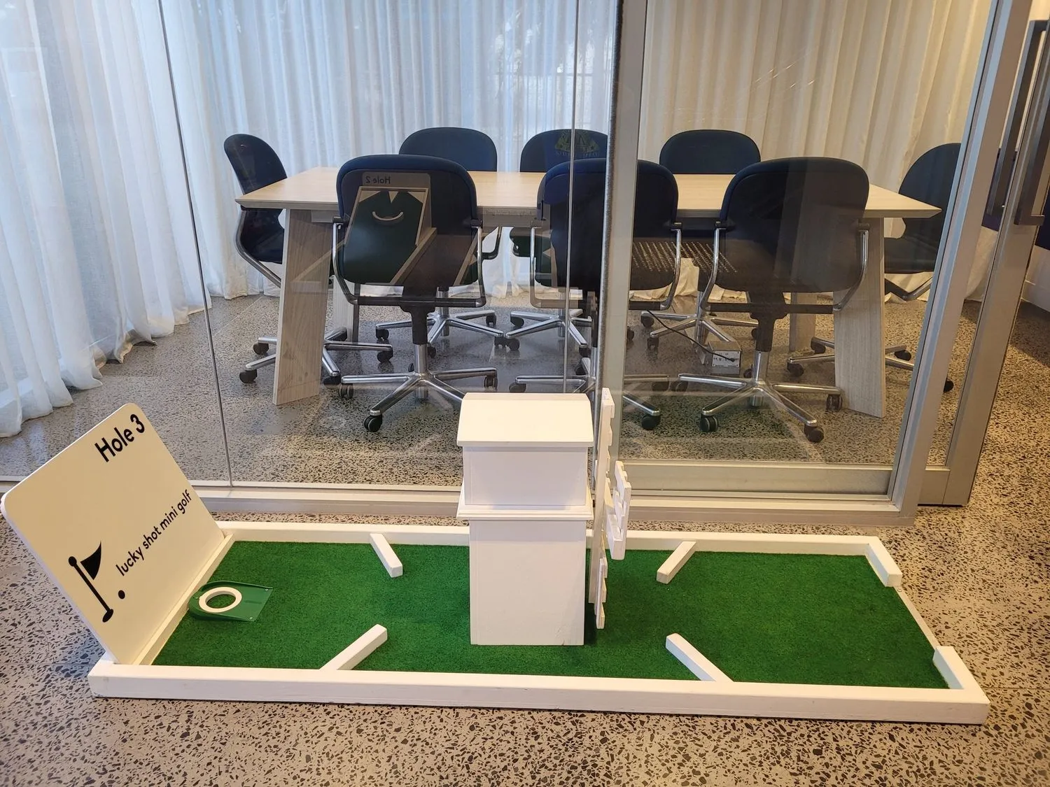 Lucky Shot premium mini golf hole installed outside a Melbourne corporate boardroom